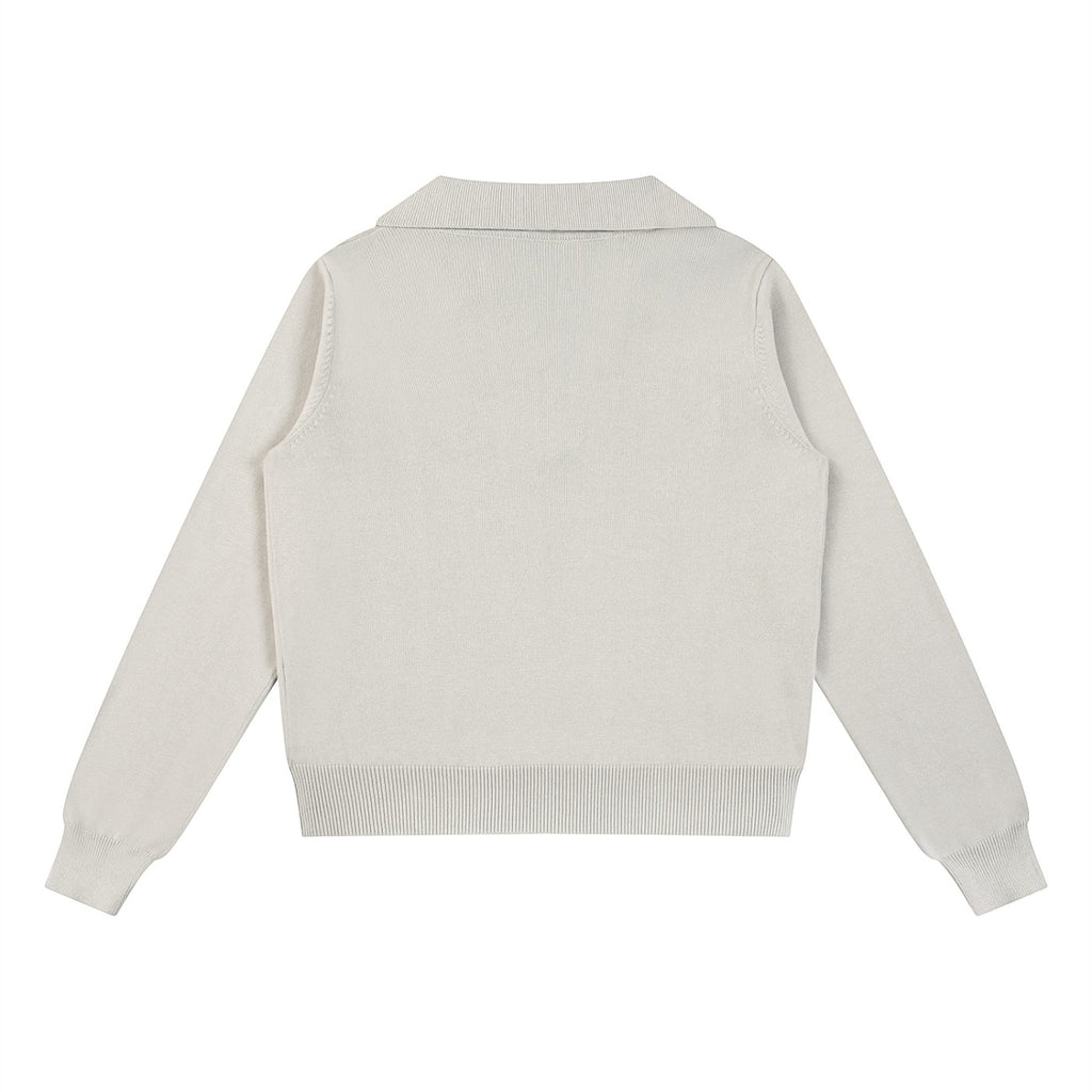 The Savage Mammoth women's beige collared knit pullover sweater, back view, featuring a thick cotton blend fabric.