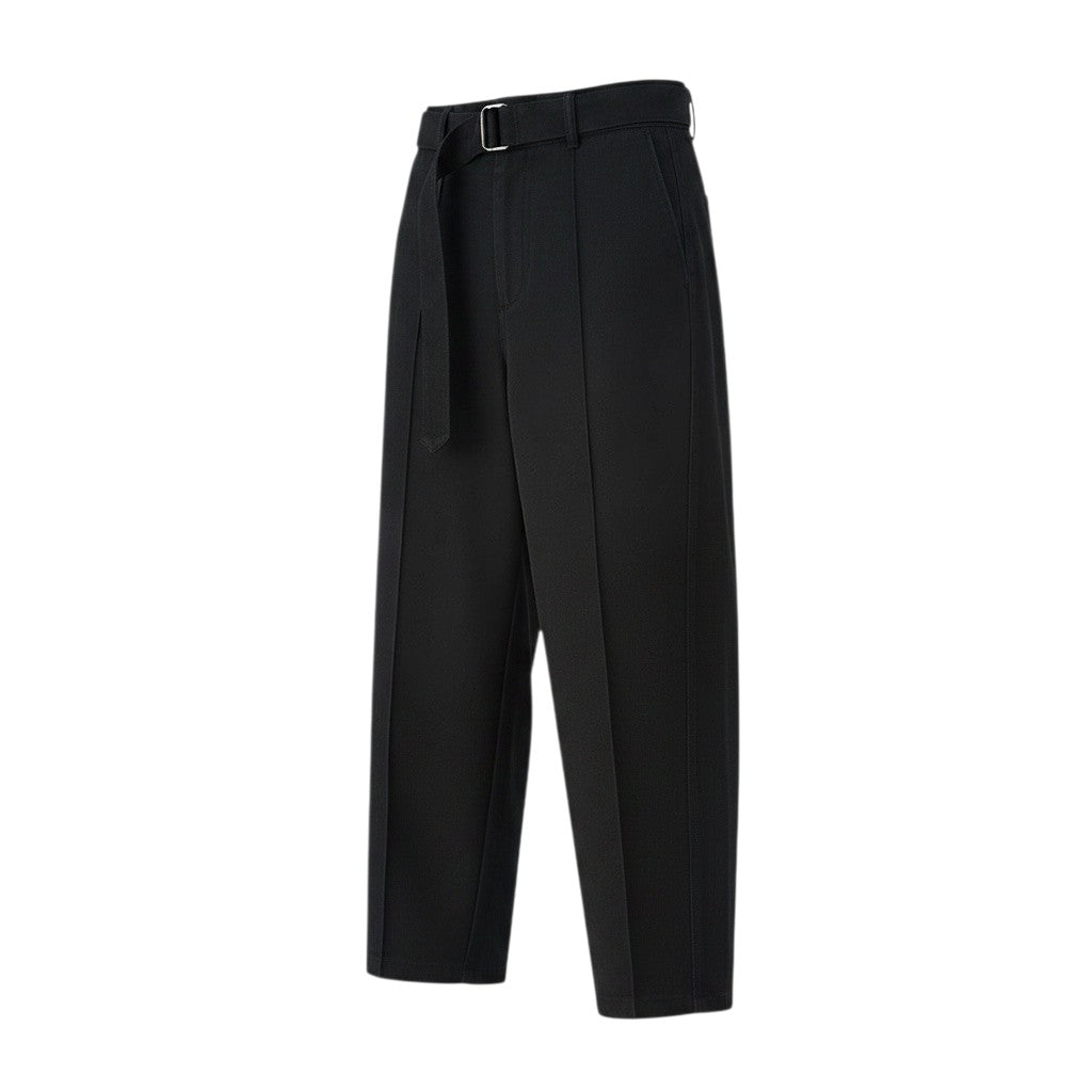 The Savage Mammoth black cotton barrel-leg chino pants with a belted waist and Controlled Chaos graphic print.